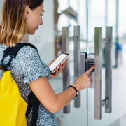 woman uses access control to enter her workplace